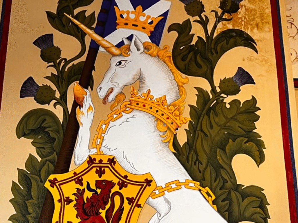 Stirling castle Unicorn Unicorn painting on a yellow background along with the lion rampant